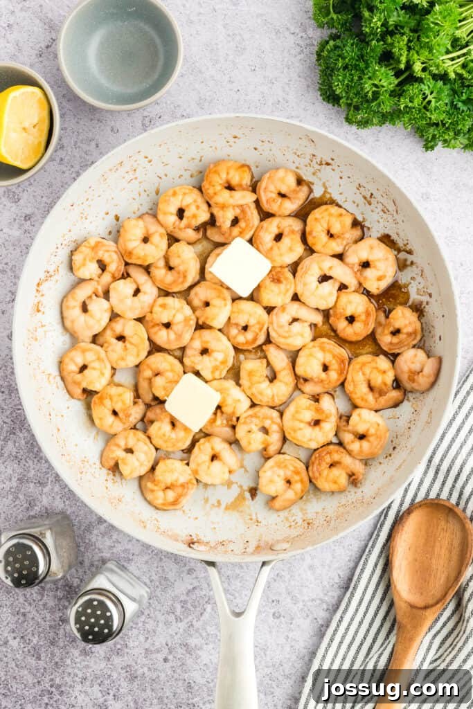 Copycat Hibachi Shrimp Recipe: Restaurant-Style at Home 12 Butter added to cooked Hibachi Shrimp in a skillet.
