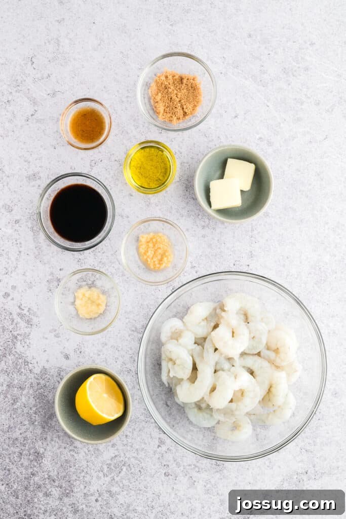 Copycat Hibachi Shrimp Recipe: Restaurant-Style at Home 3 Ingredients for Hibachi Shrimp arranged on a light countertop, including raw shrimp, soy sauce, sesame oil, brown sugar, garlic, ginger, butter, and lemon.