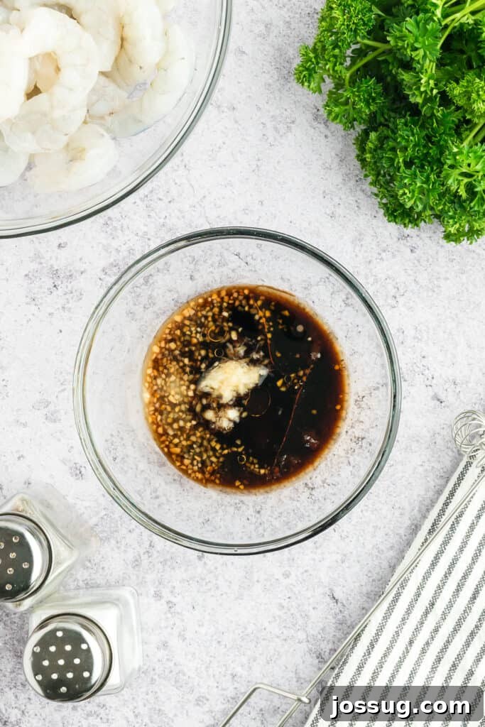 Copycat Hibachi Shrimp Recipe: Restaurant-Style at Home 5 Soy sauce, sesame oil, garlic, ginger, and brown sugar combined in a glass bowl to make Hibachi Shrimp marinade.