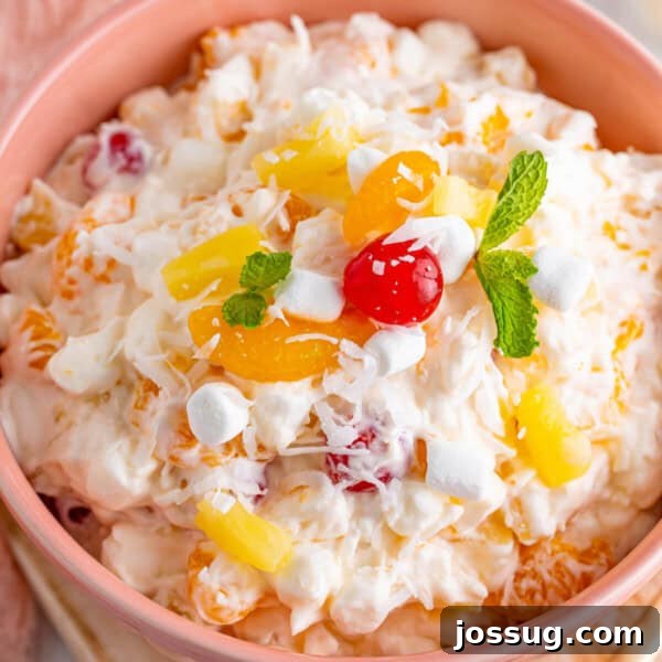 closeup of ambrosia salad in pink bowl