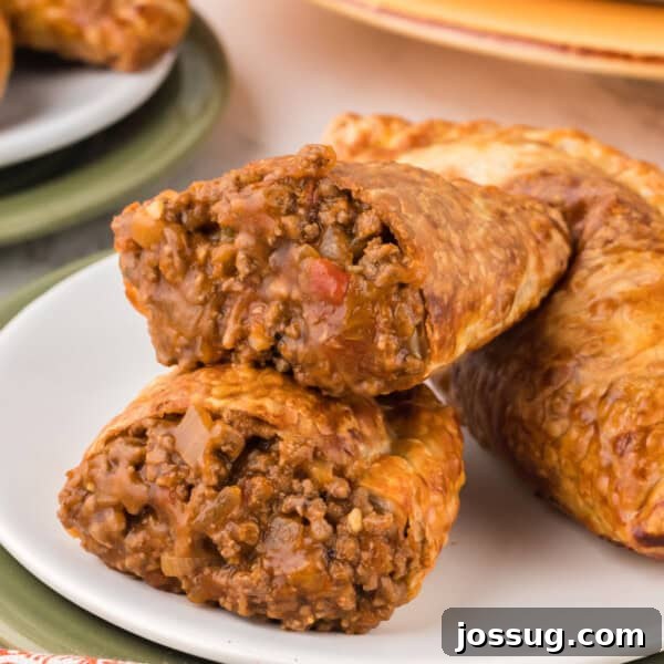 Smash Burger Tacos: Viral Cheeseburger-Style Taco Recipe 12 closeup of a beef empanada split in half to show the saucy inside