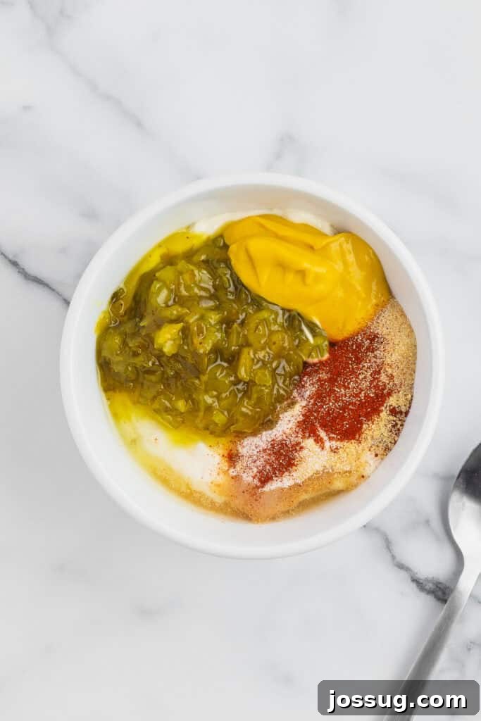Smash Burger Tacos: Viral Cheeseburger-Style Taco Recipe 6 Mayonnaise, pickle relish, mustard, vinegar, paprika, onion powder, and garlic powder combined in a bowl before mixing.