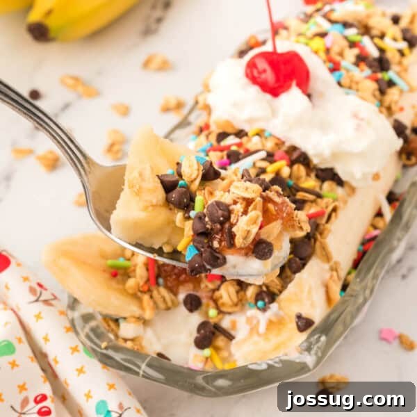 Decadent Banana Split Trifle Recipe with Layers of Cream and Fruit 22 bite of breakfast banana split on spoon