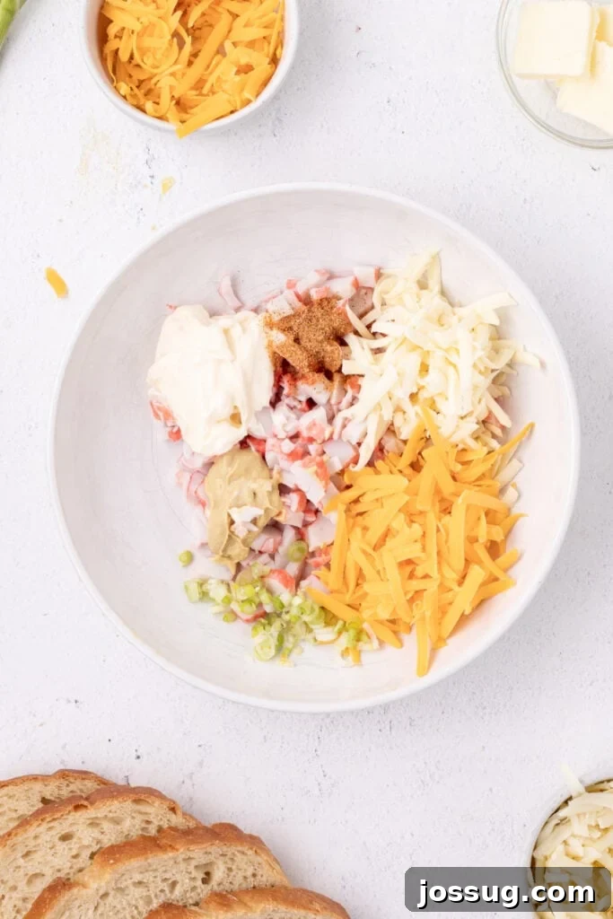 Cheesy Crab Melt: Seafood Grilled Cheese Sandwich Recipe 5 Imitation crab, shredded cheese, mayonnaise, mustard, green onions, and seasoning in a mixing bowl before being combined