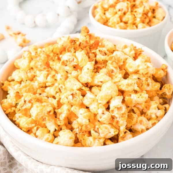Buffalo Ranch Popcorn in a large white bowl with spicy buffalo seasoning for game-day snacks and movie nights