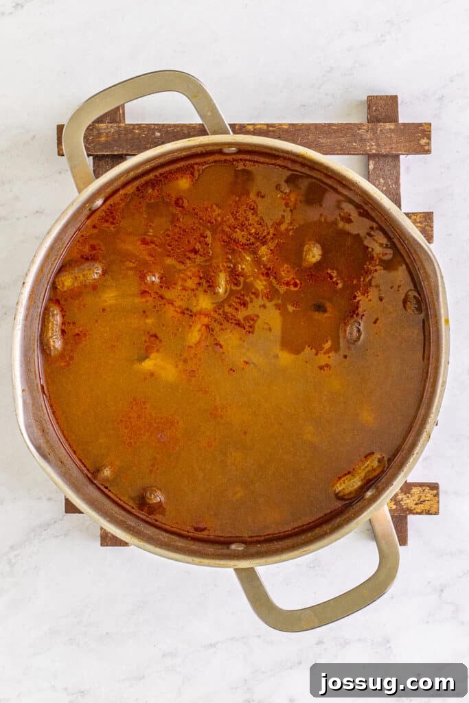 Creole Boiled Peanuts simmering in seasoned cooking liquid.