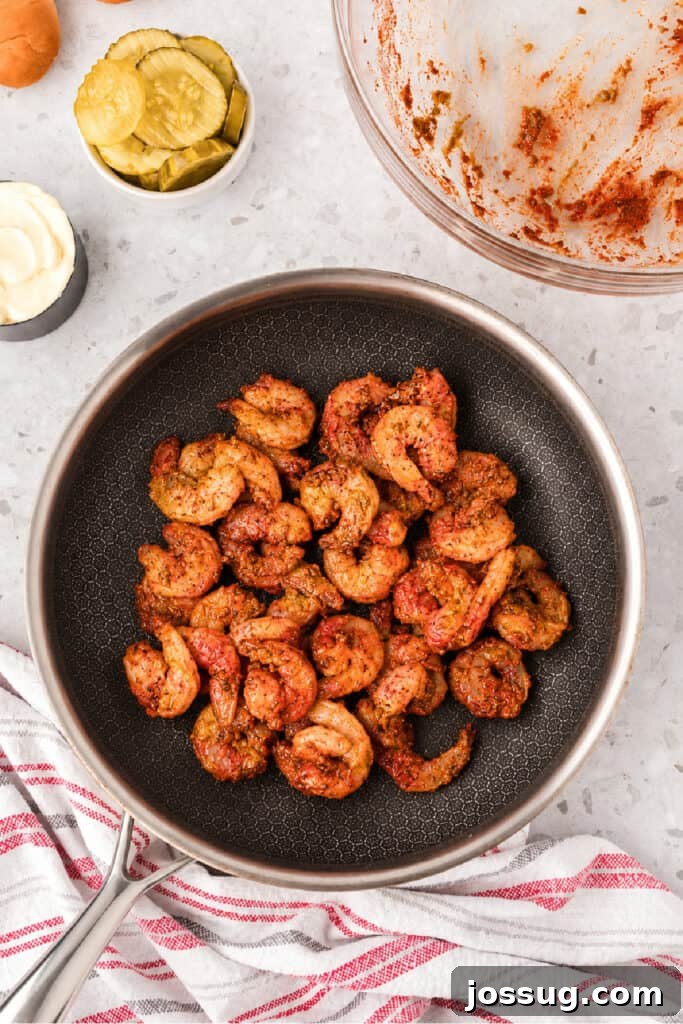 Smoky Barbecue Shrimp Po' Boy Sandwich Recipe 9 Raw barbecue shrimp in a skillet