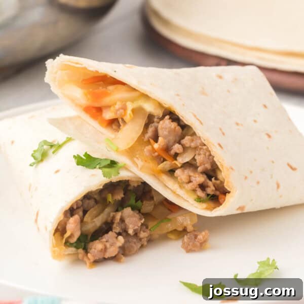 Mongolian Pork Stir-Fry: Restaurant Flavor at Home 12 Thai pork burrito cut in half on plate