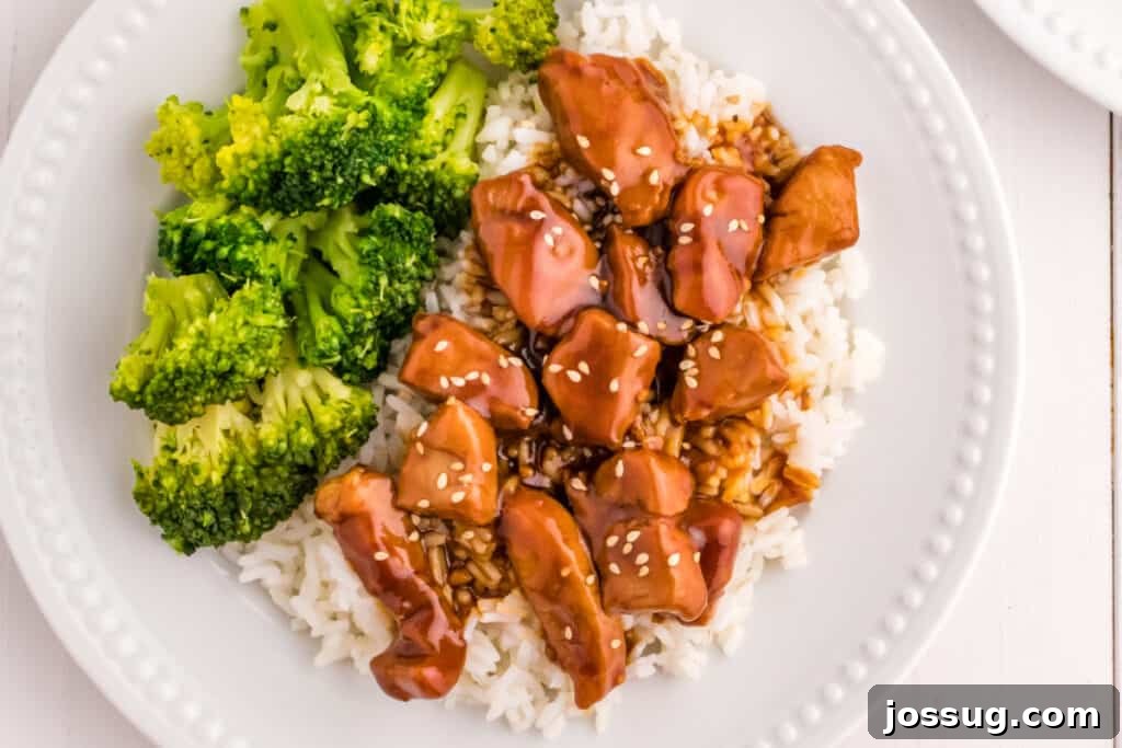 Mongolian Pork Stir-Fry: Restaurant Flavor at Home 4 Mongolian Pork bowl with steamed rice, broccoli, and sesame seeds