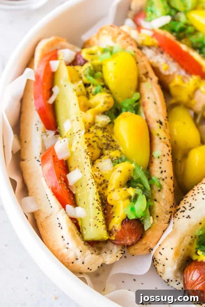 Close-up of a homemade Chicago Dog with classic Chicago-style toppings on a poppy seed bun