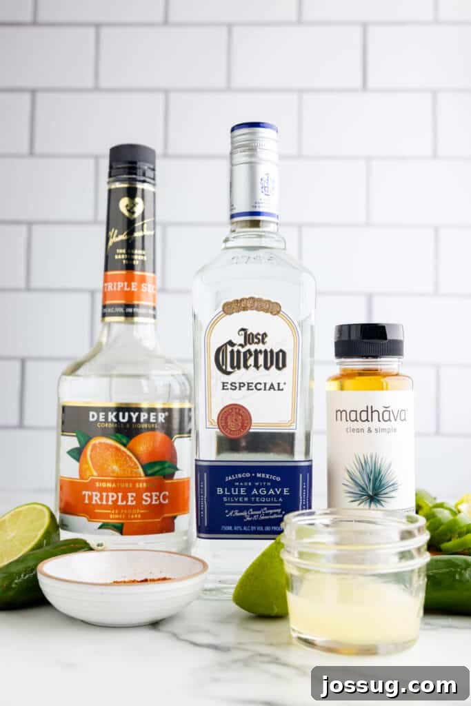 Jalapeño Margarita: Spicy Lime Cocktail Recipe 3 Ingredients for a spicy margarita recipe including blanco tequila, triple sec, fresh lime juice, agave nectar, and jalapeños