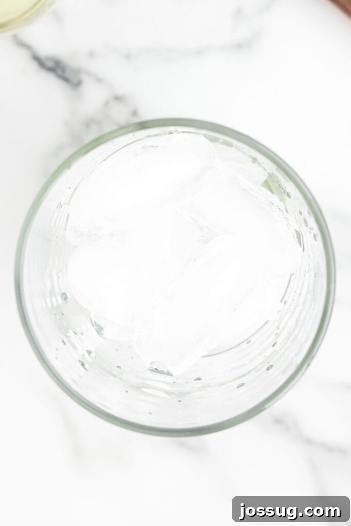 Jalapeño Margarita: Spicy Lime Cocktail Recipe 7 Ice added to a mixer glass for serving a spicy margarita