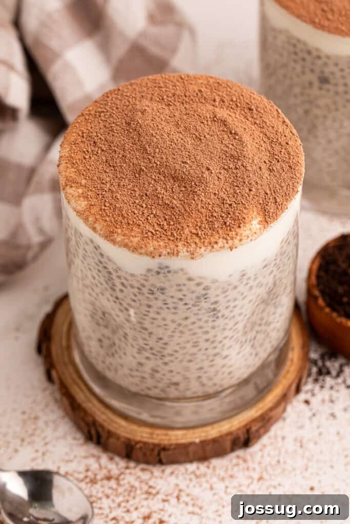 Tiramisu Chia Pudding Recipe: Coffee Cream Breakfast or Dessert 2 Tiramisu Chia Pudding topped with Greek yogurt and cocoa powder in a glass