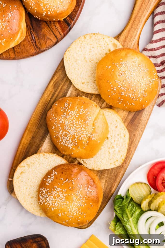 How to Make Soft Homemade Hamburger Buns 2 Close-up of a soft homemade hamburger bun with sesame seeds and sliced open