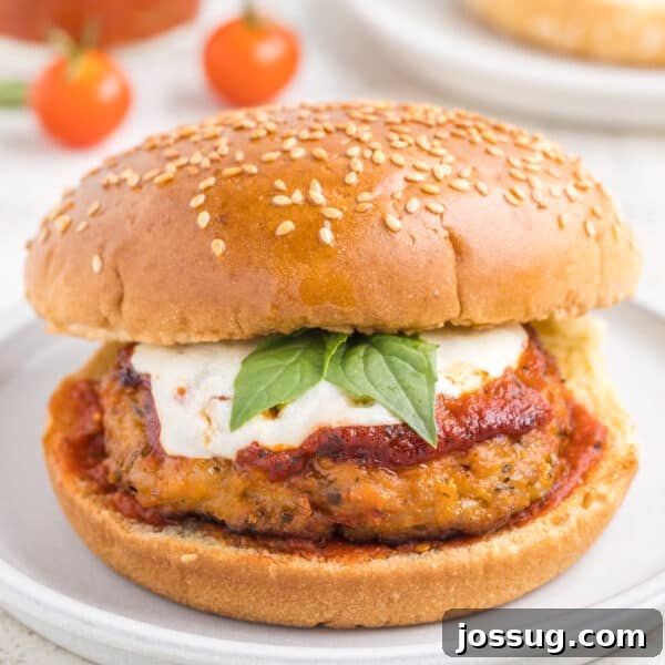 How to Make Soft Homemade Hamburger Buns 12 Chicken Parm Burger with marinara sauce, mozzarella cheese, and basil on a sesame seed bun