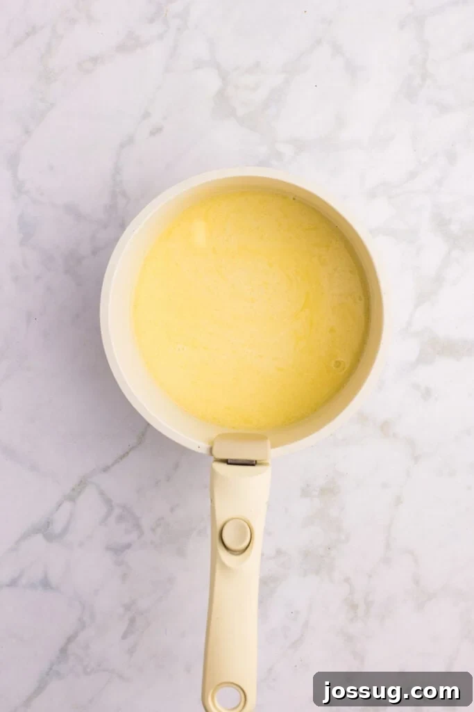 How to Make Soft Homemade Hamburger Buns 7 Warm milk mixture after the butter has melted for homemade hamburger buns