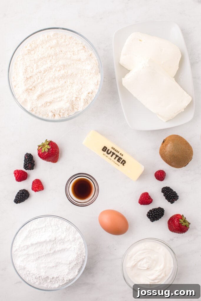 Fruit Pizza Cookies: Sugar Cookie Dessert with Fresh Fruit 3 Ingredients needed to make Fruit Pizza Cookies arranged on a countertop.