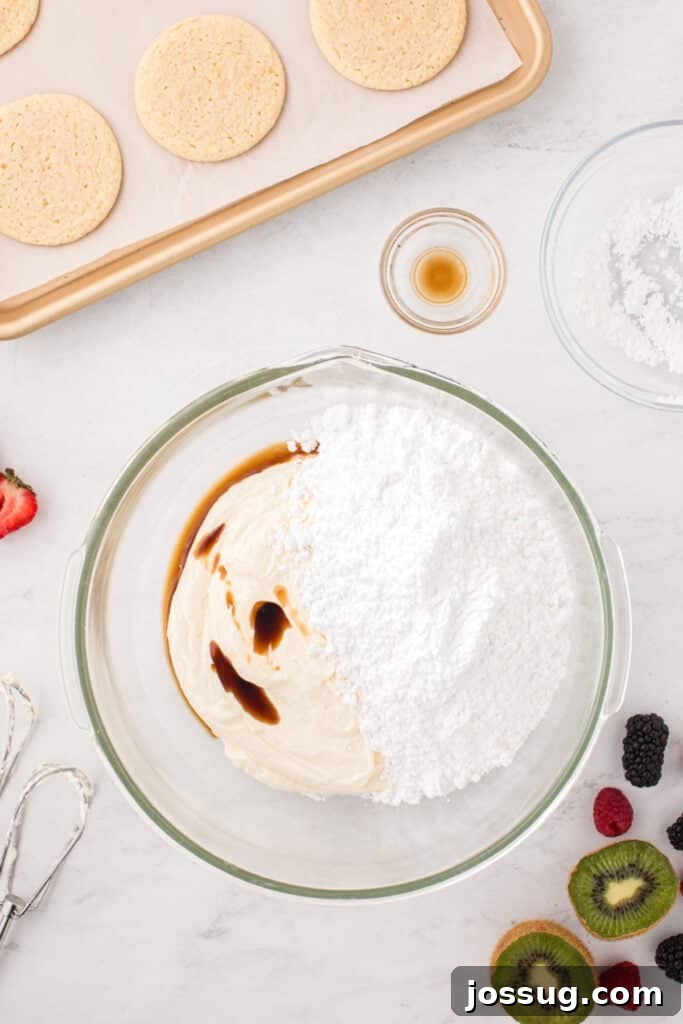 Fruit Pizza Cookies: Sugar Cookie Dessert with Fresh Fruit 10 Cream cheese frosting ingredients combined in a mixing bowl.