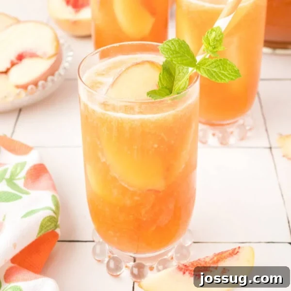 Frozen Peach Bellini Cocktail Recipe for Summer 11 glass filled with peach iced tea