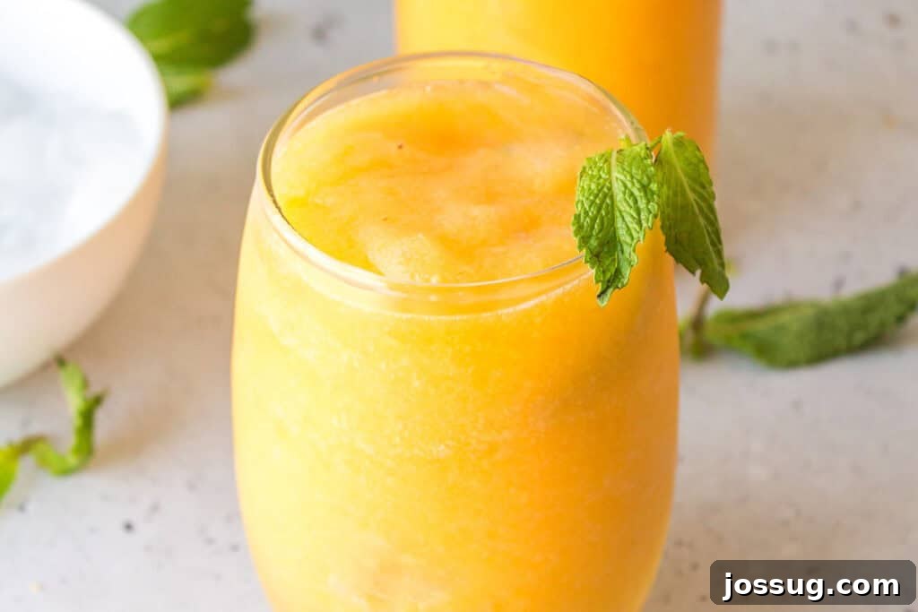 Frozen Peach Bellini Cocktail Recipe for Summer 4 Frozen peach Prosecco cocktail served with fresh mint and a thick icy consistency.
