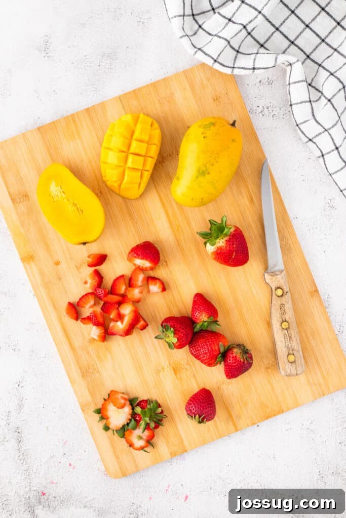 Halo-Halo: Authentic Filipino Shaved Ice Recipe 8 Slicing fresh mangoes and strawberries for homemade Halo Halo.