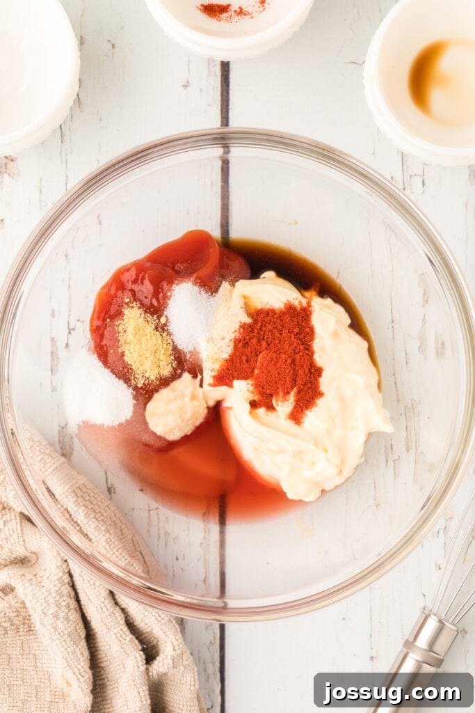 Homemade Fry Sauce Recipe: Tangy Dipping Sauce 5 Mayonnaise, ketchup, vinegar, and seasonings combined in a glass bowl to make Fry Sauce.