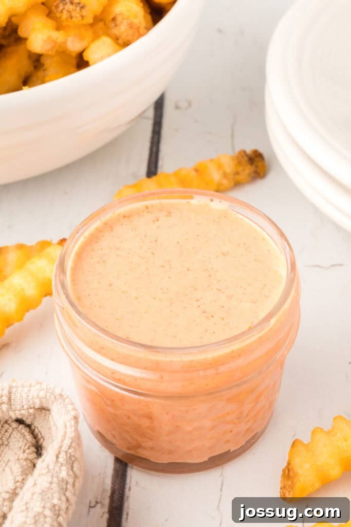 Homemade Fry Sauce Recipe: Tangy Dipping Sauce 8 Homemade Fry Sauce in a small glass jar served with crispy crinkle-cut French fries.