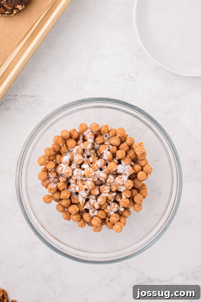 Caramel bits melted with heavy cream to make a smooth caramel drizzle for Easy Turtle Cookies.