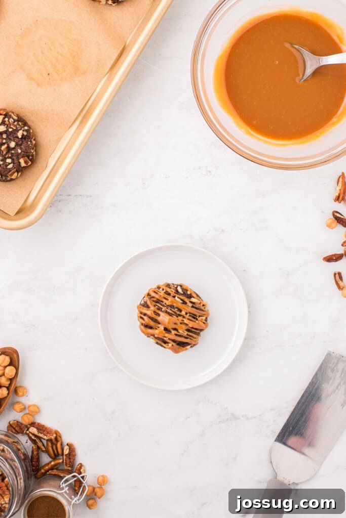 Freshly baked Easy Turtle Cookie topped with warm caramel drizzle.