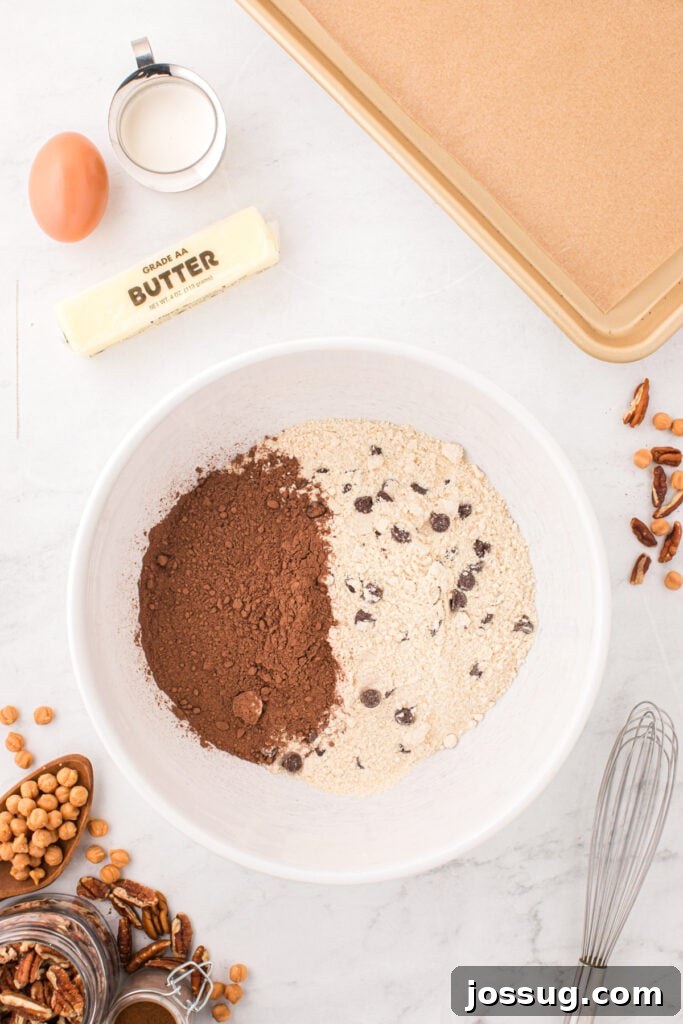 Chocolate chip cookie mix and cocoa powder in a mixing bowl before making Easy Turtle Cookies.