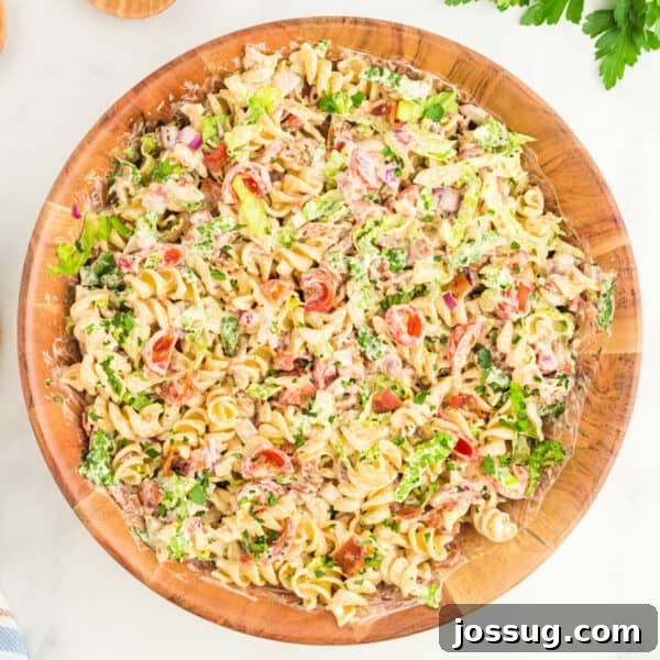 Southern-Style Sweet Potato Salad Recipe 11 square image of BBQ Ranch BLT Pasta Salad in a bowl with rotini pasta, bacon, lettuce, tomatoes, and creamy BBQ ranch dressing