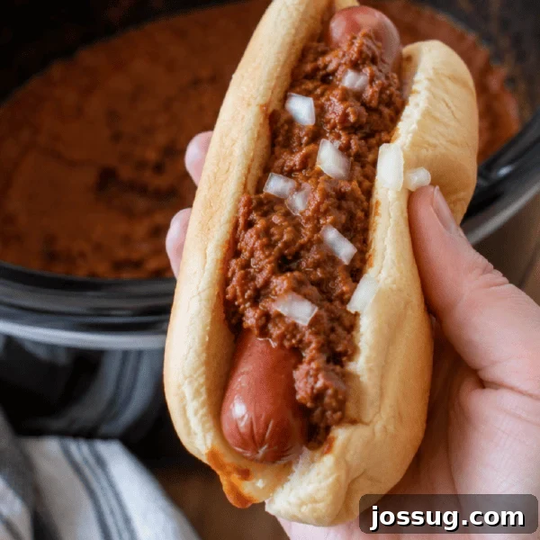 Southern-Style Sweet Potato Salad Recipe 12 Homemade chili dog topped with Slow Cooker Hot Dog Chili in a square food photo.