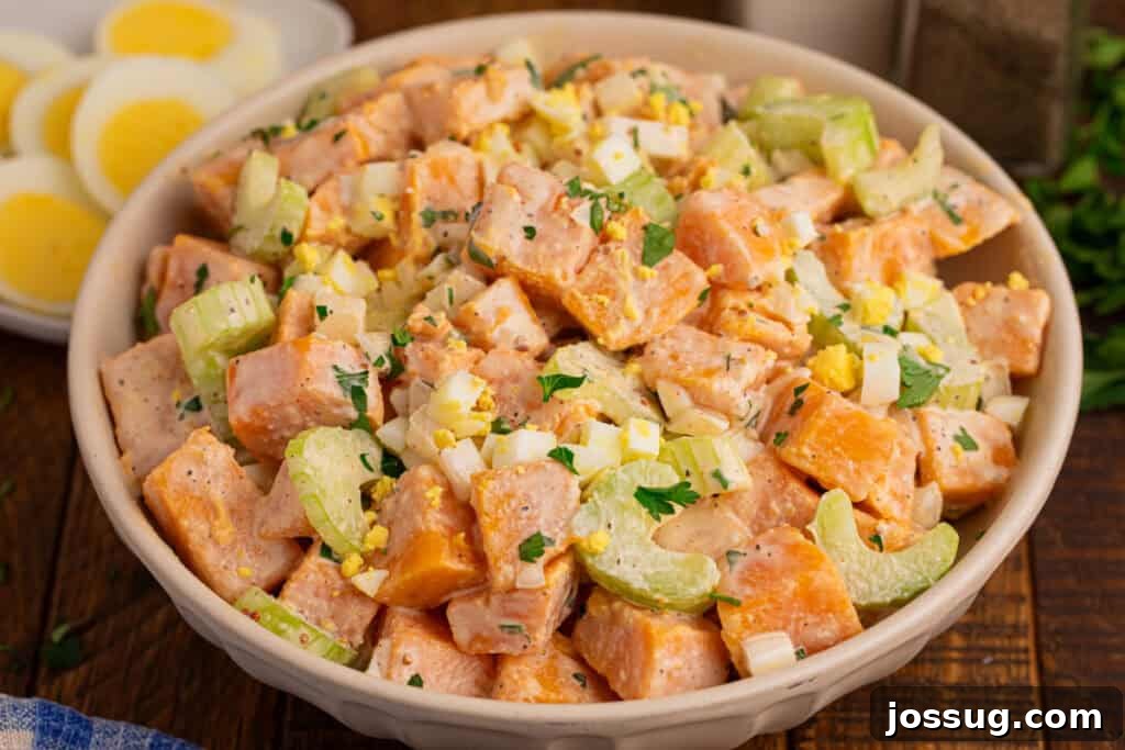 Southern-Style Sweet Potato Salad Recipe 4 Bowl of Southern-style Sweet Potato Salad with creamy sweet potatoes, hard-boiled eggs, celery, onion, and parsley