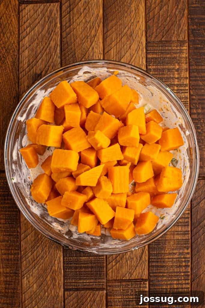 Southern-Style Sweet Potato Salad Recipe 7 Cooked sweet potato cubes added to the creamy seasoned dressing mixture before being gently folded together