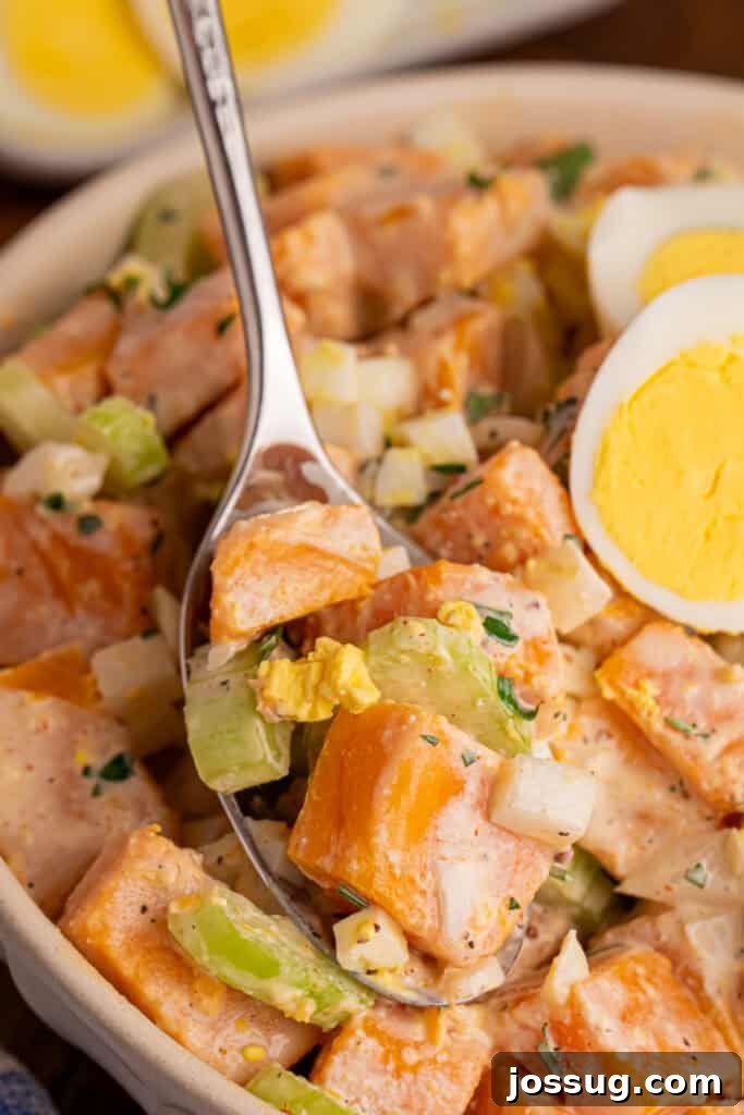 Southern-Style Sweet Potato Salad Recipe 9 Spoonful of creamy Sweet Potato Salad with sweet potato, celery, onion, chopped egg, and fresh parsley