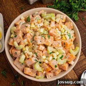 Overhead Sweet Potato Salad with creamy sweet potatoes, celery, onion, chopped eggs, and fresh parsley