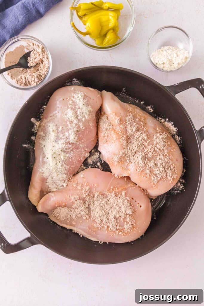 Smoked Mississippi Chicken with Ranch and Pepperoncini 6 Chicken breasts sprinkled with ranch seasoning and au jus gravy mix in a skillet