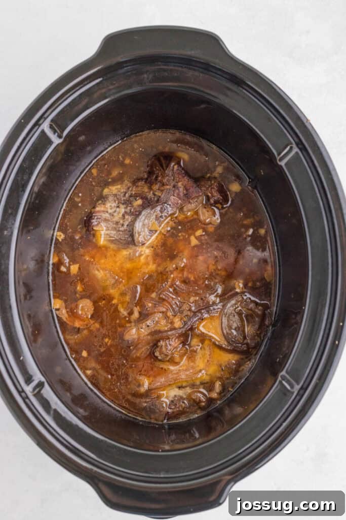 Slow Cooker Asian Pot Roast with Ginger Soy Glaze 6 Tender chuck roast after slow cooking in the savory soy, ginger, and garlic sauce