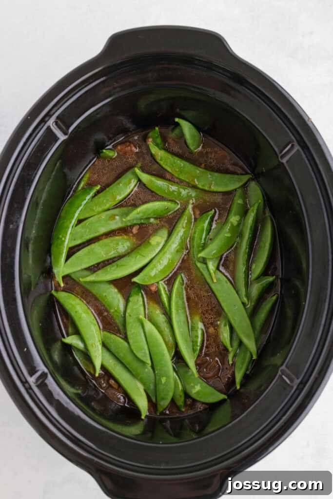 Slow Cooker Asian Pot Roast with Ginger Soy Glaze 7 Fresh snap peas added to the slow cooker with the tender Asian pot roast