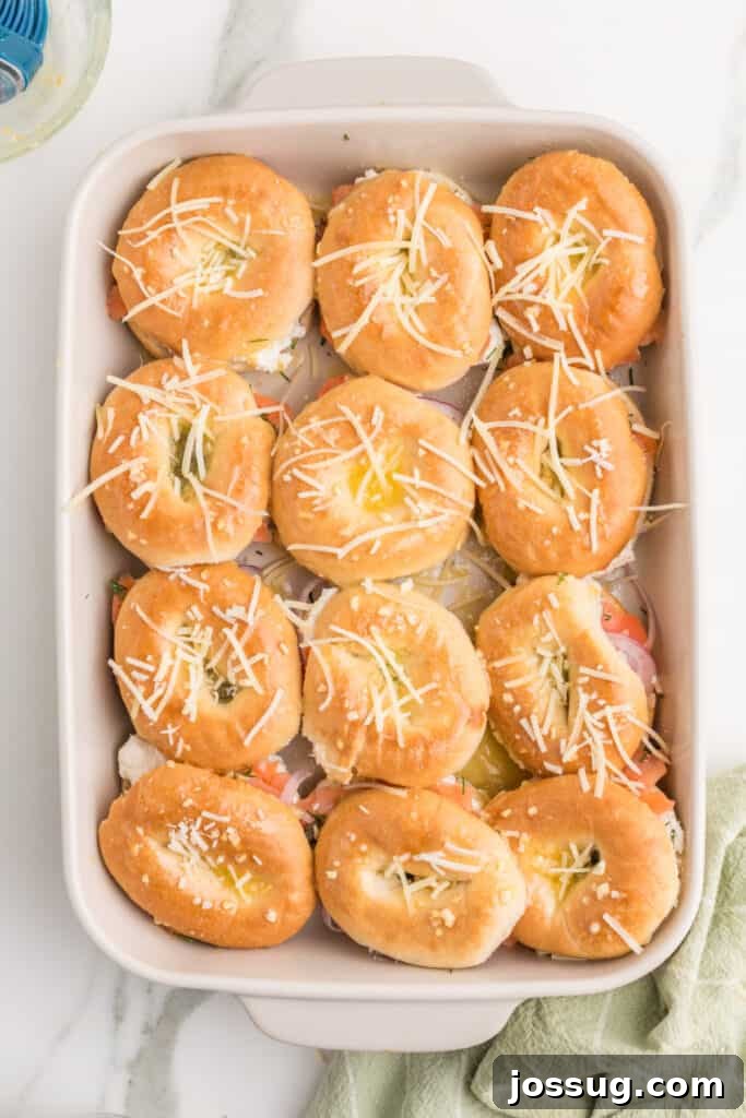 Baked Bagel and Smoked Salmon Sliders 16 Parmesan cheese sprinkled over buttered mini bagel sliders before baking