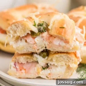 Baked Bagel and Smoked Salmon Sliders 21 Baked Bagels & Lox Sliders stacked with smoked salmon, cream cheese, red onion, capers, and fresh dill