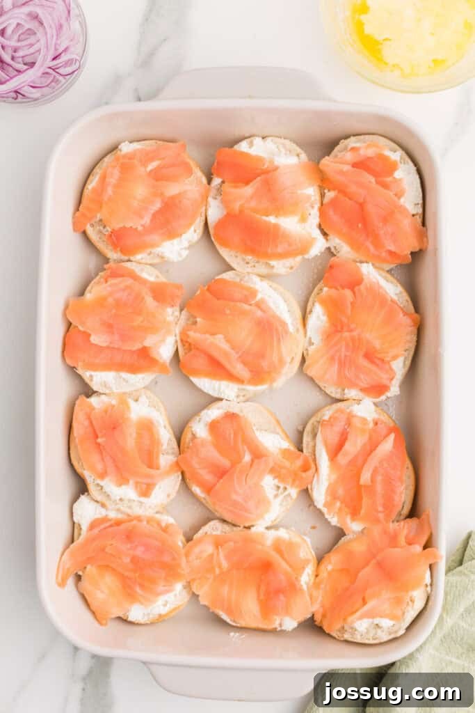 Baked Bagel and Smoked Salmon Sliders 7 Smoked salmon layered over cream cheese on mini bagel bottoms