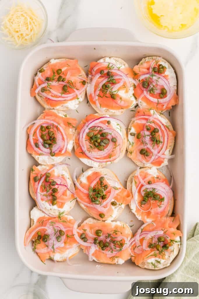 Baked Bagel and Smoked Salmon Sliders 10 Fresh dill sprinkled over smoked salmon, capers, and red onion on mini bagels